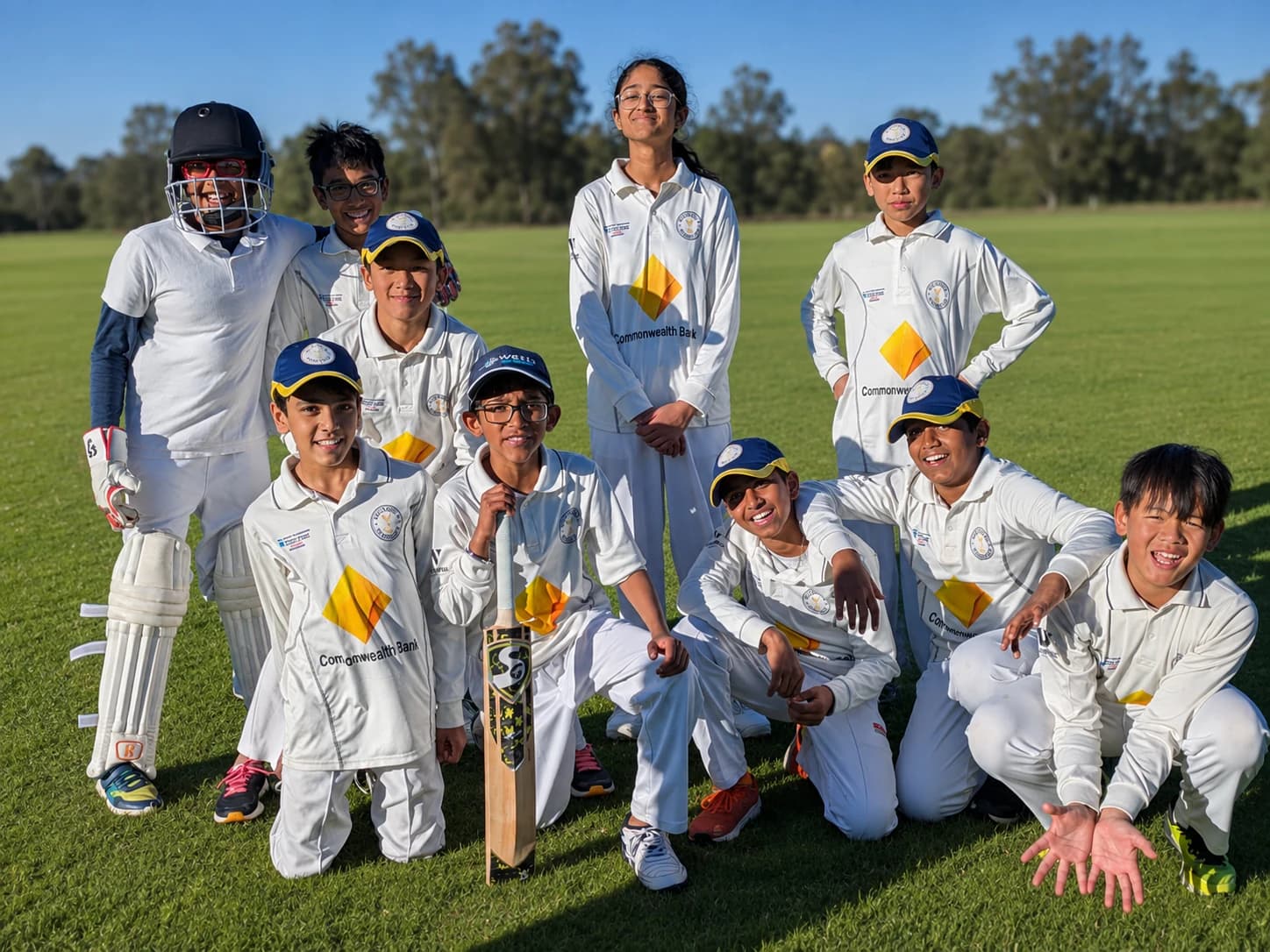 Willowdale junior cricket team together on the field