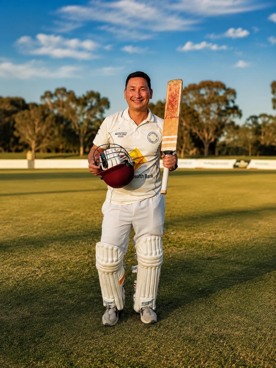 Willowdale Cricket Club batter holding a helmet and bat