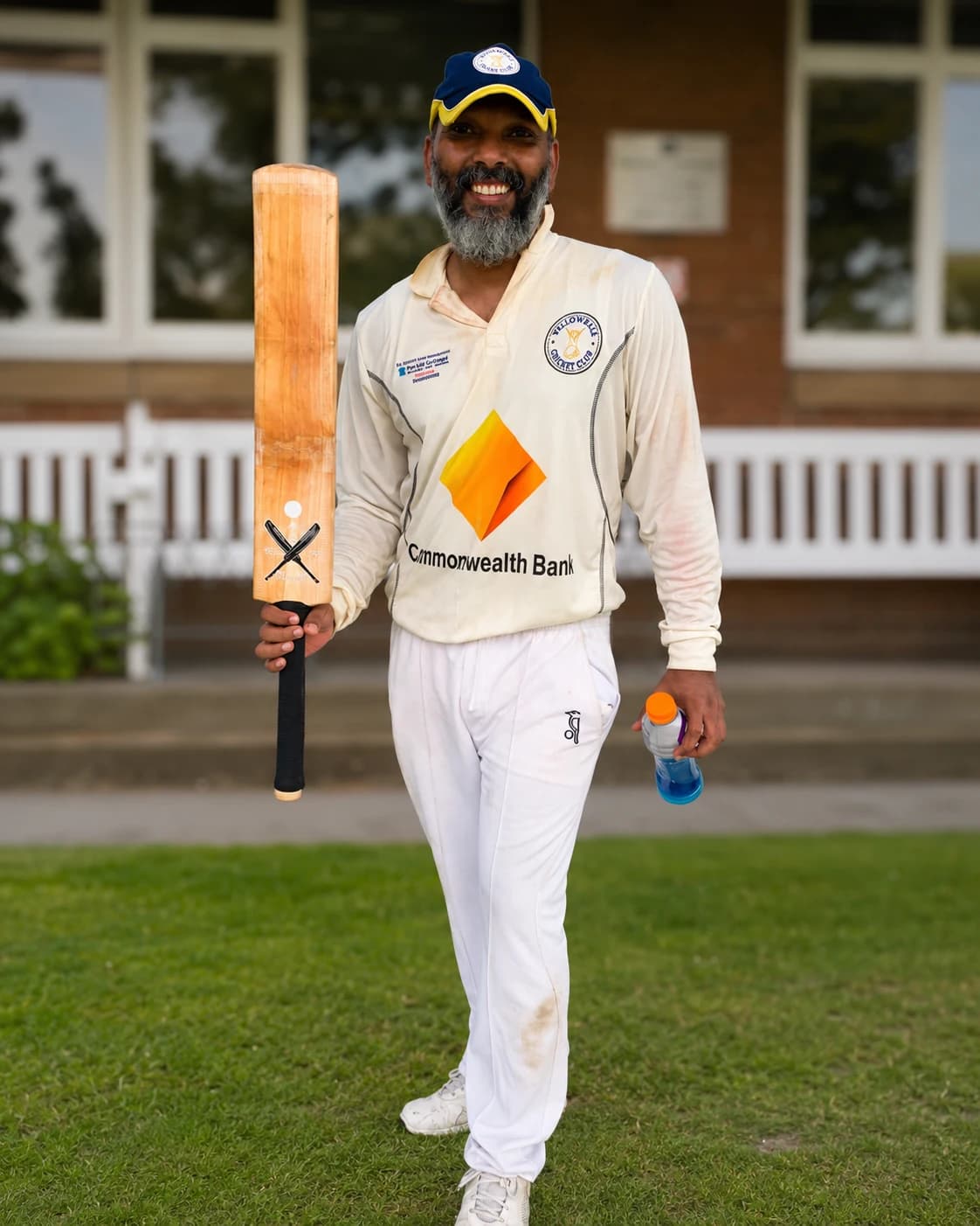Willowdale senior batter walking with a cricket bat